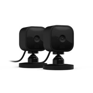 Two black security cameras on stands.