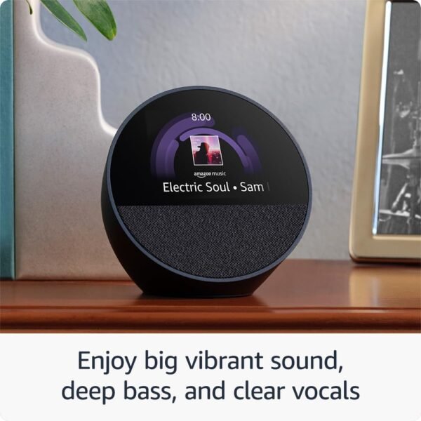 Smart speaker with music display on wooden shelf.