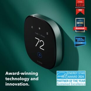Smart thermostat with awards on green wall