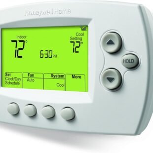 Digital thermostat displaying temperature and time settings.