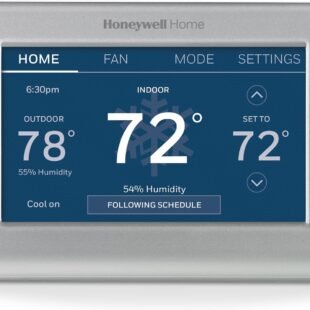 Smart thermostat displaying indoor and outdoor temperatures.